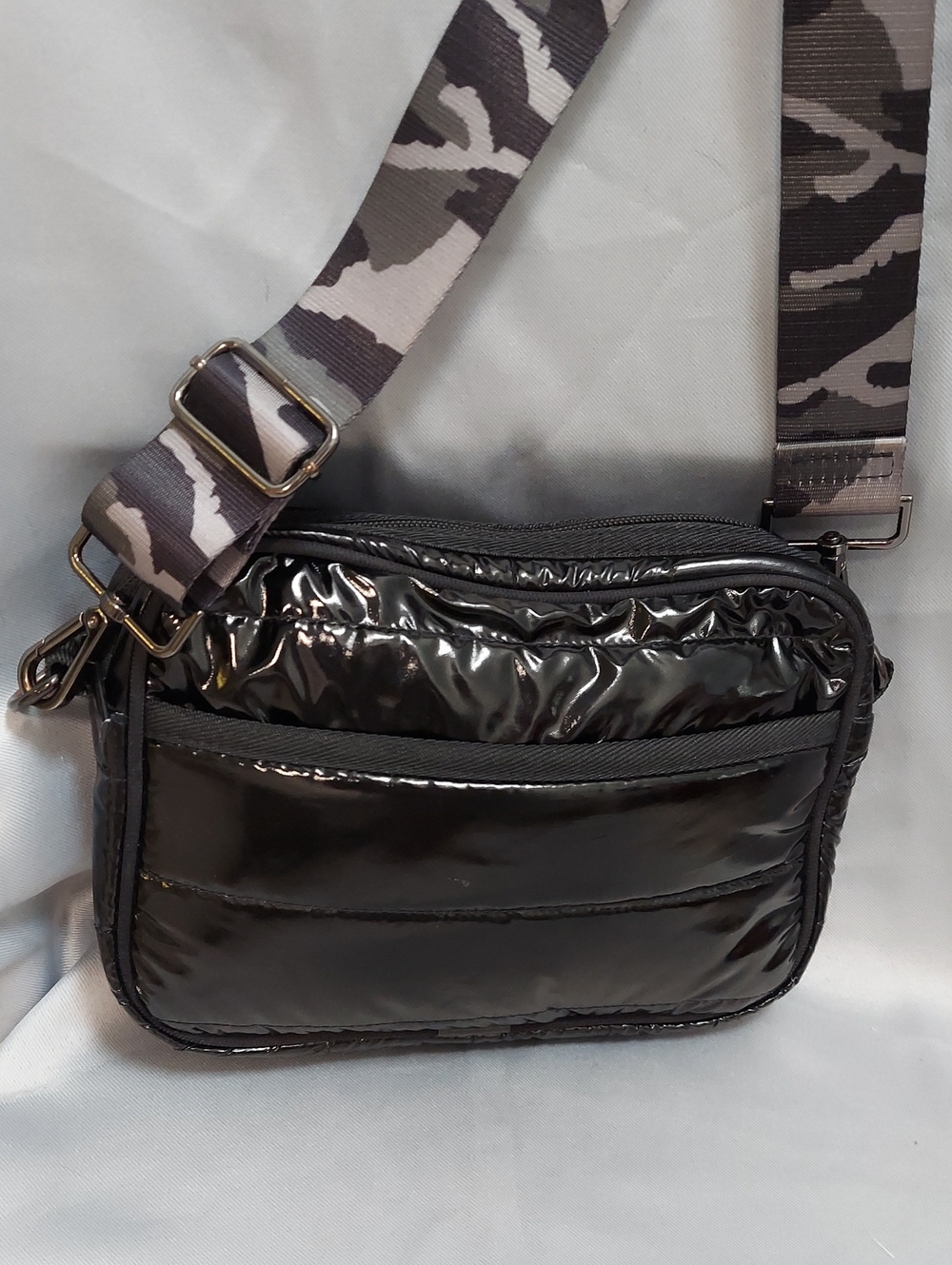 Haute Shore Crossbody Bag, Shiny Black Puffer, Camo Strap, Zip Close